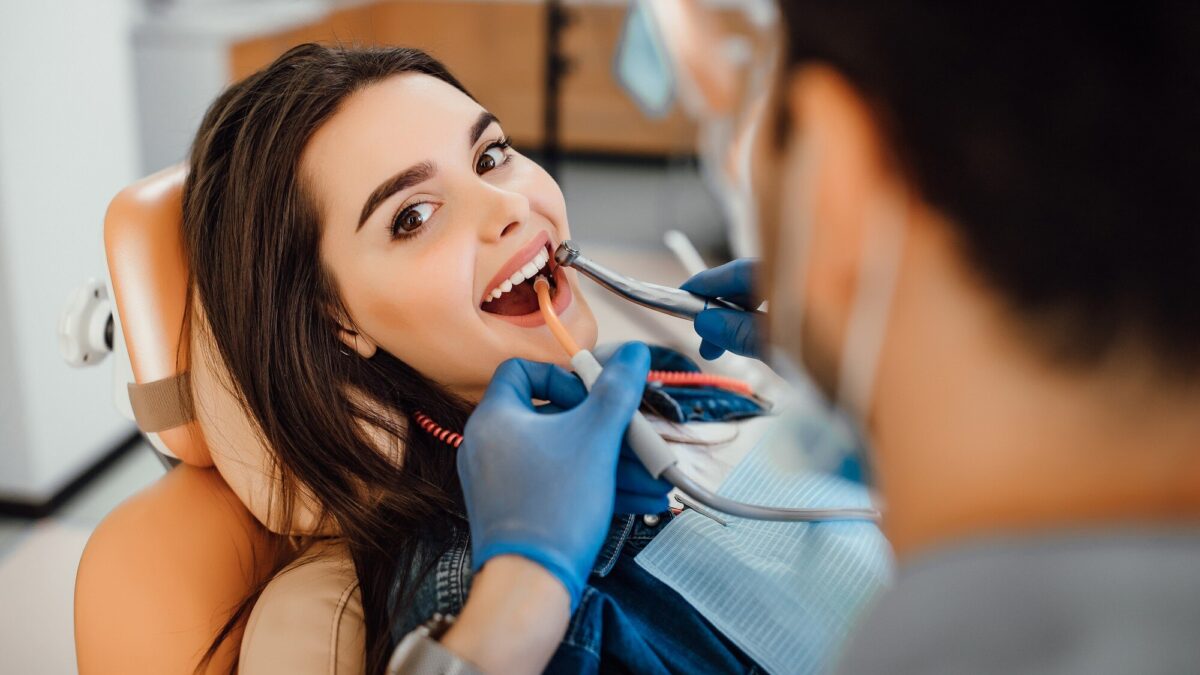 young female patient visiting dentist office 496169 930