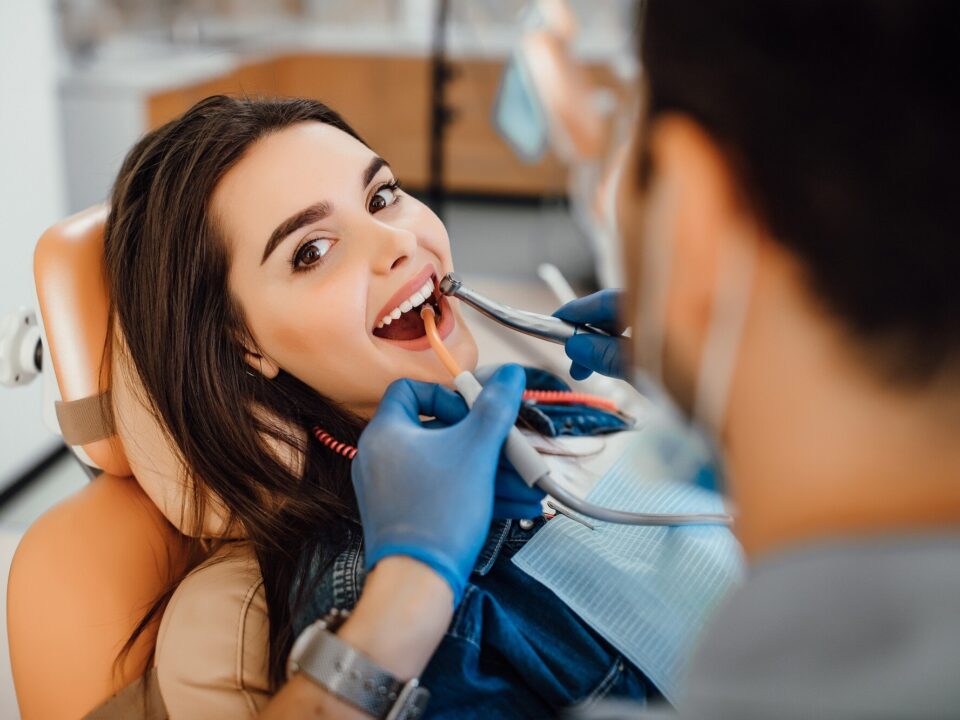 young female patient visiting dentist office 496169 930